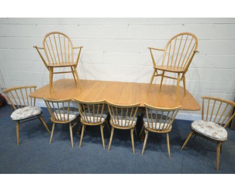 AN ERCOL ELM EXTENDING DINING TABLE, with three additional leaves, extended length 252cm closed length 160cm x depth 102cm x 