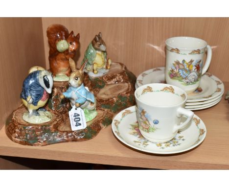 A BESWICK BEATRIX POTTER'S FIGURE STAND WITH FIVE CHARACTERS, comprising 'Squirrel Nutkin' gold gilt backstamp, 'Peter Rabbit