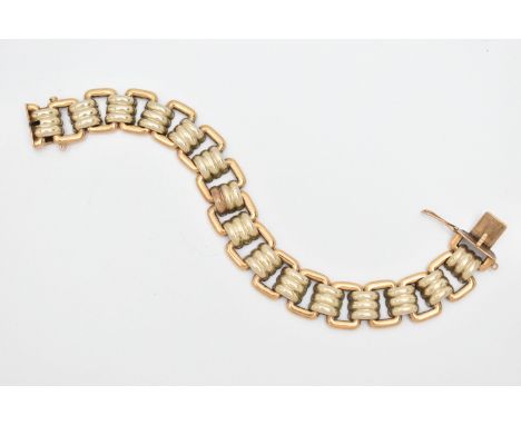 A MODERN WHITE AND YELLOW METAL BRACELET, designed as a series of fifteen white metal grooved links, interspaced by plain pol