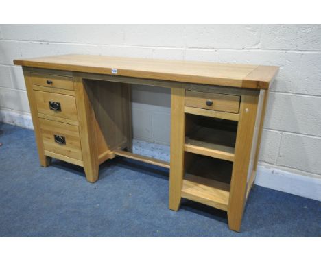 A SOLID LIGHT OAK KNEE HOLE DESK, fitted with an arrangement of four drawers and a single shelf, width 150cm x depth 50cm x h