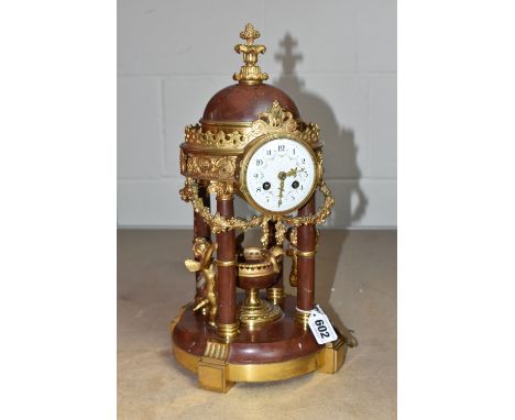 A LATE 19TH CENTURY MARBLE AND GILT METAL MANTEL CLOCK IN THE FORM OF A FOUR COLUMN ROTUNDA TEMPLE, gilt finial to the marble