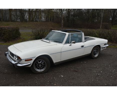 A 1974 TRIUMPH STAG CONVERTIBLE, REGISTRATION NUMBER JOJ 949N, finished in white with blue trim, triumph V8 2998cc petrol eng