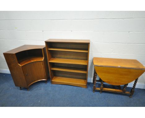 A 20TH CENTURY OAK BARLEY TWIST GATE LEG TABLE, an open bookcase and a mid-century teak corner cupboard (condition report: al