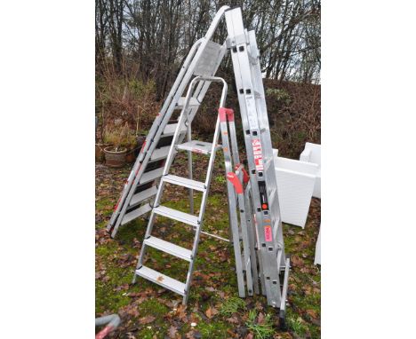 AN ALUMINIUM DOUBLE EXTENSION LADDER with 7 rungs to each 195cm length, four step ladders and a Youngman board (6)