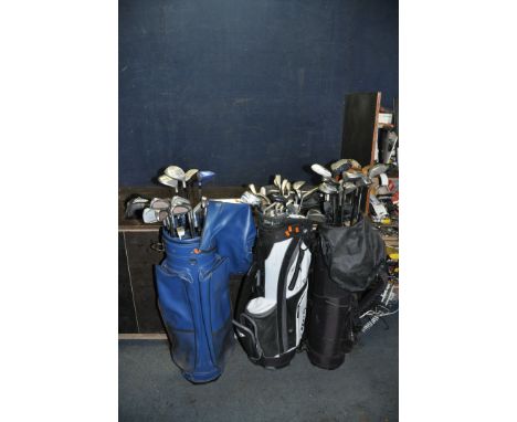 THREE GOLF BAGS CONTAINING TWENTY SEVEN IRONS, twenty one drivers and three putters from makers such as Pinseeker, Howson, Ma