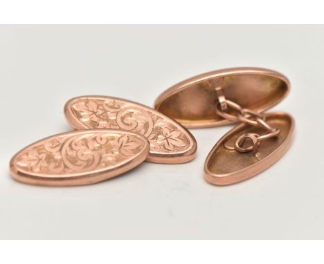 A PAIR OF EARLY 20TH CENTURY 9CT GOLD OVAL CUFFLINKS, oval foliate pattern panels, chain linked, hallmarked 9ct Chester 1924,