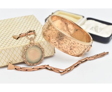 A SMALL ASSORTMENT OF JEWELLERY, to include a rolled gold portrait fob, embossed detail with viewing panel, set with a lock o