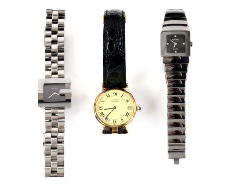 A Must de Cartier mid-size silver gilt wristwatch, crown set with a blue stone, circular cream dial with black Roman numerals
