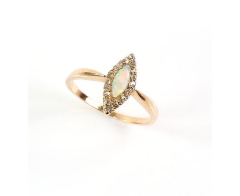 Edwardian ring, centrally set with marquise cabochon cut opal, surrounded by a border of rose cut diamond, mounted in 15 ct, 