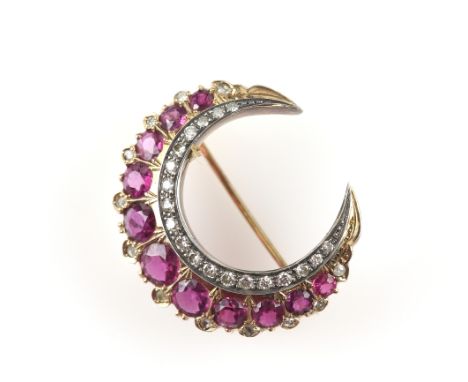 Early 20th C ruby and diamond gold crescent brooch, set with eleven round faceted rubies, the largest estimated at 0.65 carat