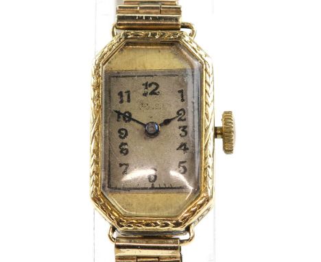 Rolex a ladies wristwatch in elongated octagonal gold case, the foliate chased sides surmounting an unsigned dial with Arabic