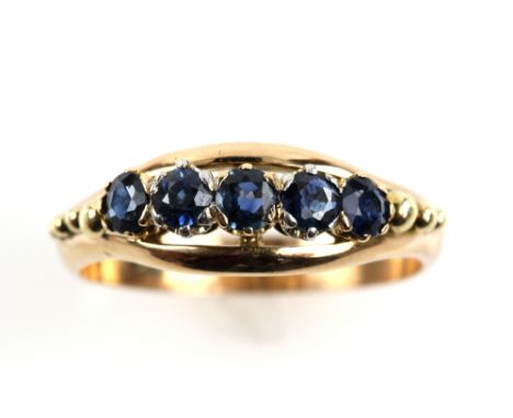 Dress ring, set with five round cut blue sapphires, ring size V, mount stamped 14 ct.      CONDITION 14 ct gross weight 5 gra