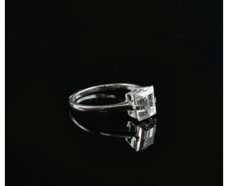 An emerald cut diamond, estimated weight, 2.39 carats, set in Art Deco style mount, stamped platinum, ring size PThis lot is 