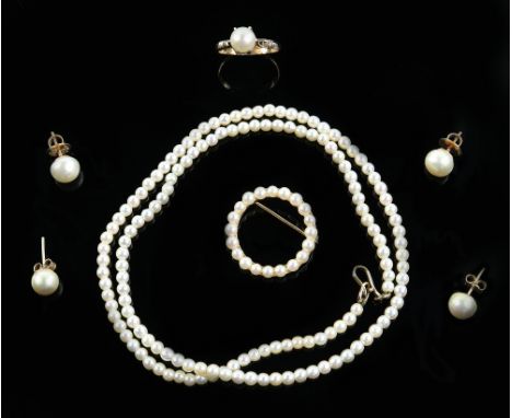 A group of cultured pearl jewellery including two pairs of stud earrings, a ring with single pearl, size O, and a circular br