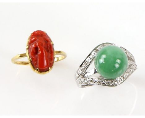 Two gold dress rings, one carved coral rmount testing as 18 ct, ring size J and a jade and diamond ring, stamped 14 ct, ring 