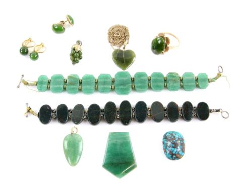 Nephrite jade a group of jewellery, ring with petal mount, in 9 ct gold, heart and grape form pendants, and two pairs of earr