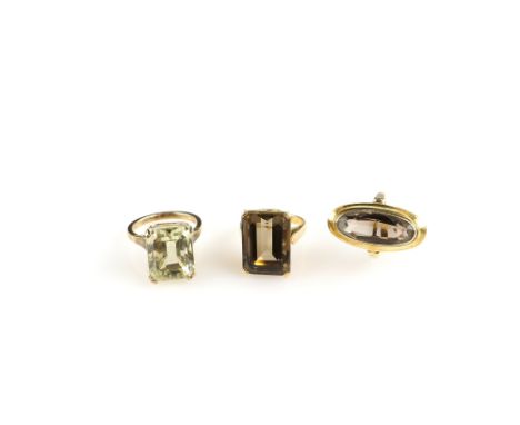 Three vintage cocktail rings, one with step cut smoky quartz in 18 ct gold mount, ring size J similar with oval stone in rub 