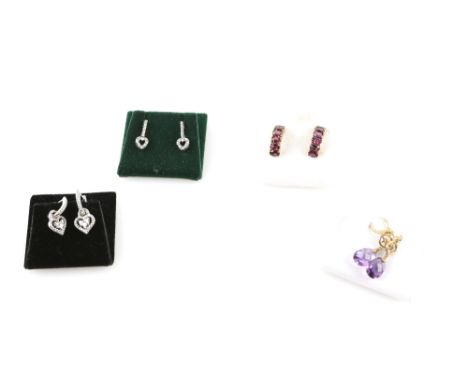 Four pairs of gold gem set earrings, two  with set diamond hearts, garnet half hoops, and amethyst set drops .      CONDITION