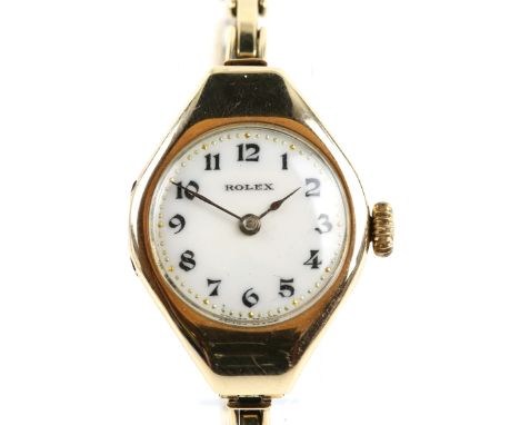 A Rolex ladies wristwatch in an oval gold case, the white enamel signed dial  with Arabic numeral hour markers and  gilt bead