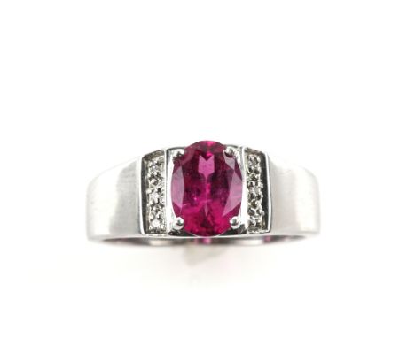 Oval cut rubelite ring, illusion set shoulders, stamped '375' for 9 ct gold, ring size M 1/2 .      CONDITIONGross weight 3.8