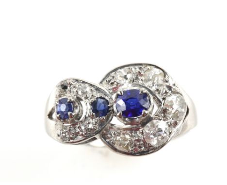 Art Deco period cocktail ring set with old cut diamonds and synthetic sapphires in 18 ct white gold, ring size M, boxed  .   