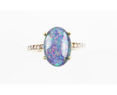 Black opal triplet ring, 14 x 9mm, diamond set shoulders, mounted in 18 ct gold, ring size P.      CONDITIONOverall good cond