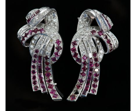 Ruby and diamond clip brooches with brilliant and baguette cut diamonds set in platinum, mid 20th century,  length 4.5 cm .  