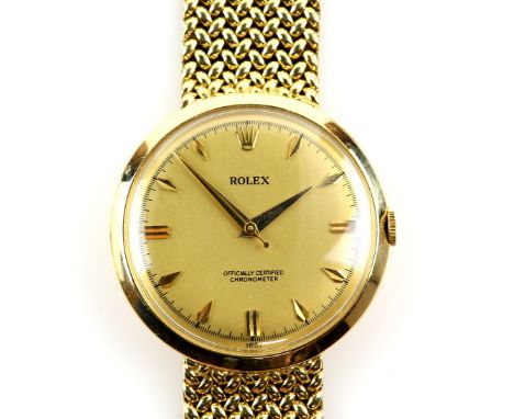 Rolex Gentleman's gold wristwatch, the circular signed dial with baton hour markers, plexiglass and fitted with a manual wind