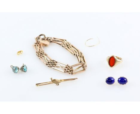 A group of gold items, one vintage gate bracelet, pheasant bar brooch, carnelian signet, ring size H, a pair of lapis lazuli 