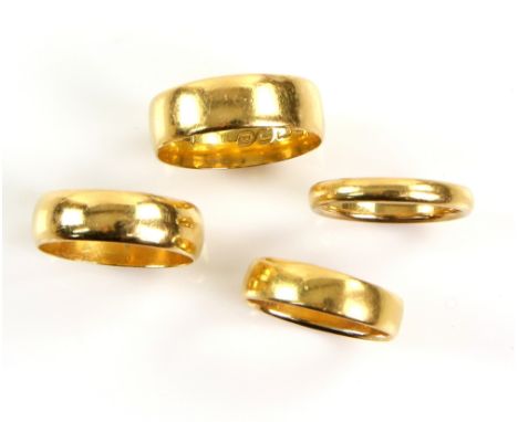 Four wedding bands, one hallmarked in Birmingham 1899, ring size O, and three other similar bands, ranging in size from O to 