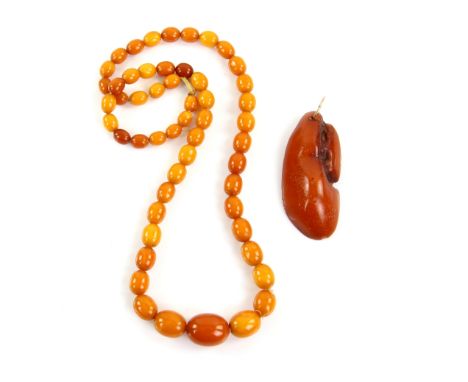 1920's amber bead necklace, graduated beads of opaque amber, length 61 cm, largest bead 23 x 18 mm, weight 41 grams and a nat