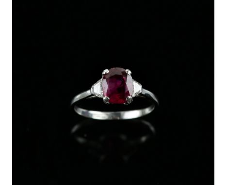 Burmese ruby and diamond ring, the ruby of 1.80 carat, set with two trapeze cut diamonds, set in platinum marked 'Tinum', rin