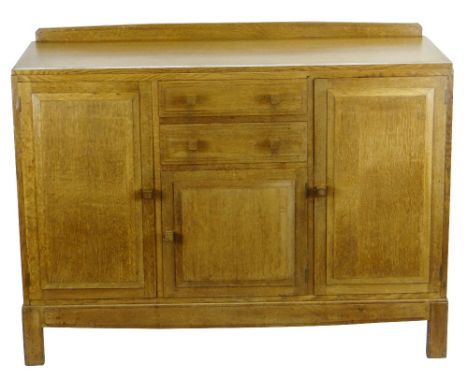 BRYNMAWR OAK RAILBACK SIDEBOARD designed by Paul Matt for Brynmawr Furniture, having two central drawers over a small shelved
