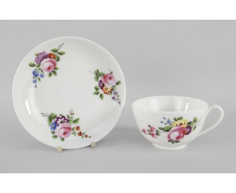 A NANTGARW PORCELAIN TEA CUP & SAUCER painted with bright flower sprays Condition Report: very small blemish beneath glaze. V