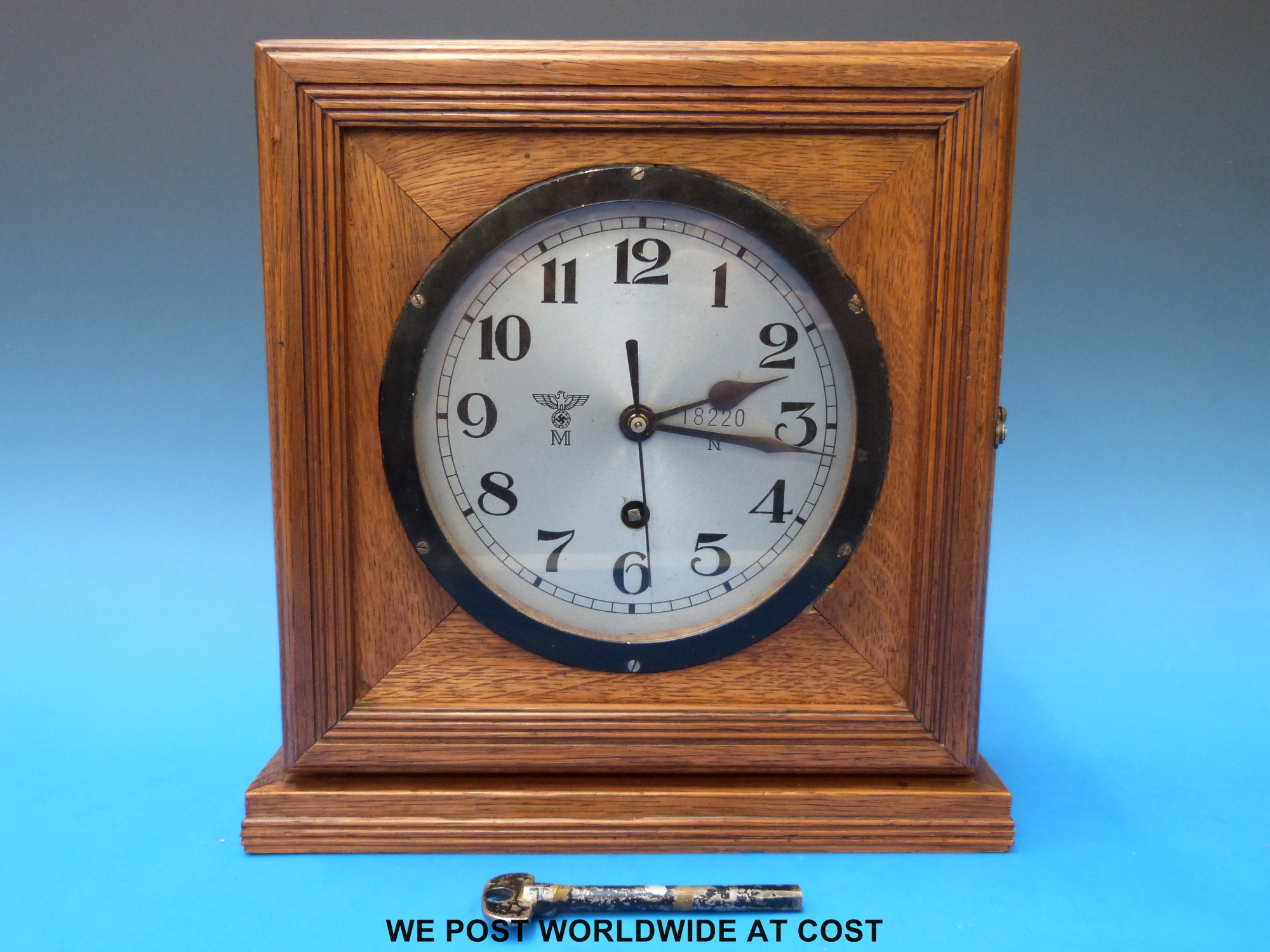 A WW2 Nazi German Uboat bulkhead clock in period oak case as used on