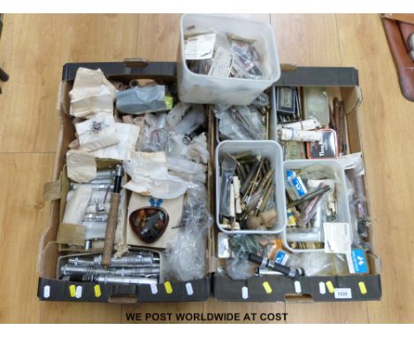 Two trays of fishing rod parts including vintage brass ferrules, hardwood butt ends, eyes (some more modern), reel seats and 