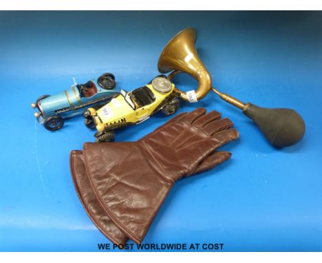 A vintage brass hand operated horn (emits a very pleasing sound), a pair of leather and lamb's wool motoring gauntlets, ceram