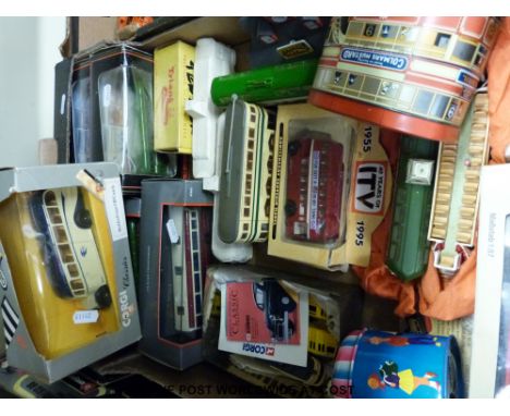 A quantity of diecast buses and trams including an early Corgi Bluebird coach, a Triang boxed GWR tender, German made street 