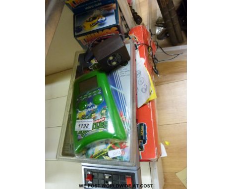 A collection of vintage video and other games to include Tomy Alien Attack and Caveman, Mask Outlaw in original box, Konami T