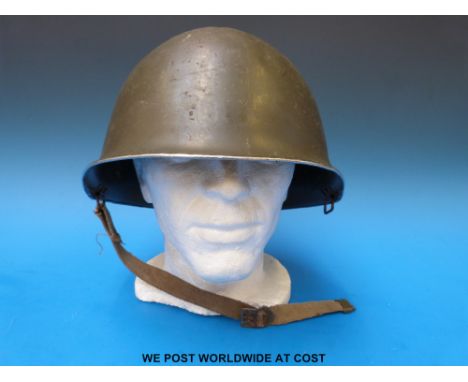 A steel helmet thought to be US, with webbing chin strap, no lining