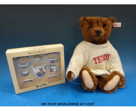 Steiff teddy bear with cinnamon mohair and jointed limbs together with a Steiff miniature tea set (both in original boxes)