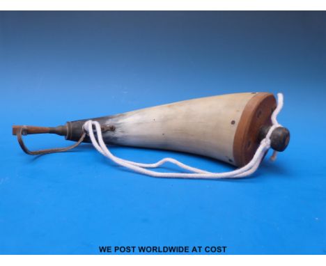 A cow horn powder flask