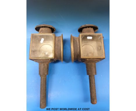 A pair of vintage brass and metal carriage lamps