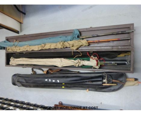 A useful wooden fishing rod box containing vintage rods including Shakespeare Alpha, President Match, named cane examples and