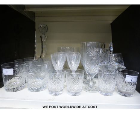 Two part suites of cut glassware, the first comprising six tumblers, six champagne flutes, three wine glasses, two vases and 