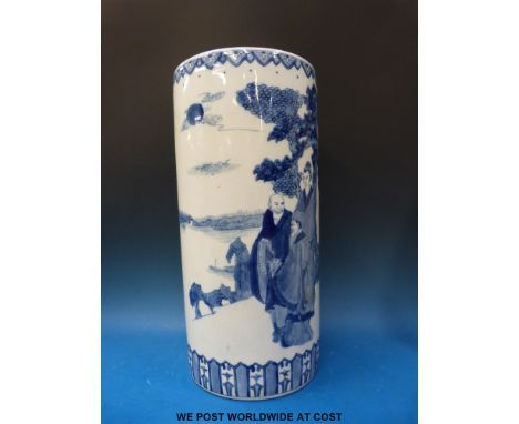 A Chinese blue and white stick stand with figural decoration, 47cm tall