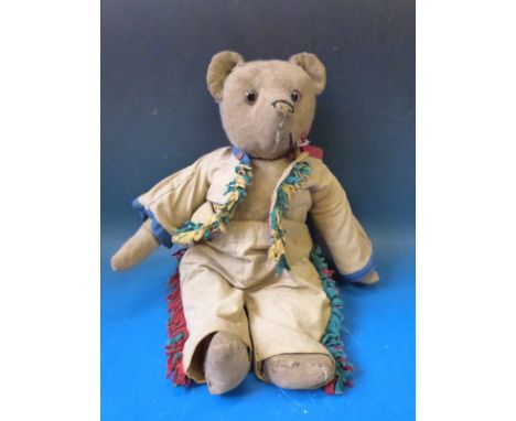 An antique possibly Steiff teddy bear with cocked feet and wrists, hump back, disc joints and growler 
