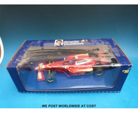 Two Minichamps Paul's Model Art 1:18 scale Jacques Villeneuve Williams diecast model Formula 1 cars: FW18 and FW20, both in o