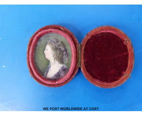 A 19thC portrait miniature painted on ivory depicting a young woman, in fitted shagreen case (maximum 3.5cm) 