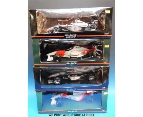 Four Minichamps Paul's Model Art 1:18 scale diecast model McLaren Formula 1 cars: D. Coulthard MP 4/13 M. Hakkinen MP4/11 and